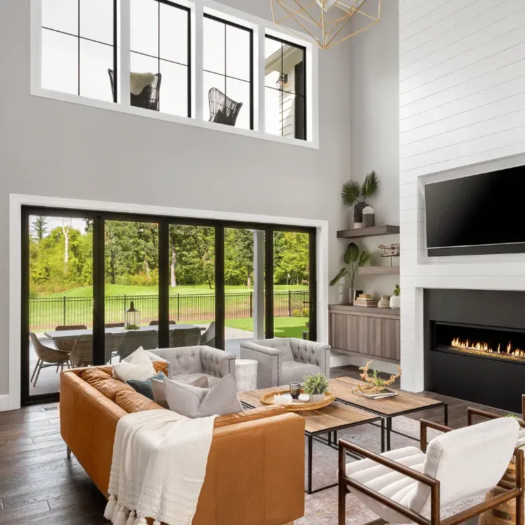 Living room with multi-slide doors and transoms